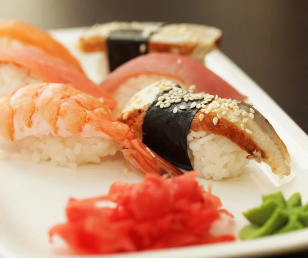 Sushi on white plate — Stock Photo, Image