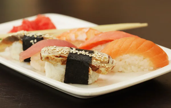 Sushi on white plate — Stock Photo, Image