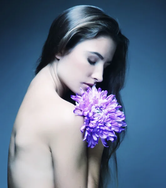 Woman with long hair holding big flower — Stock Photo, Image
