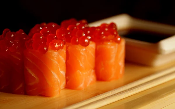 Rolls with salmon and red caviar — Stock Photo, Image