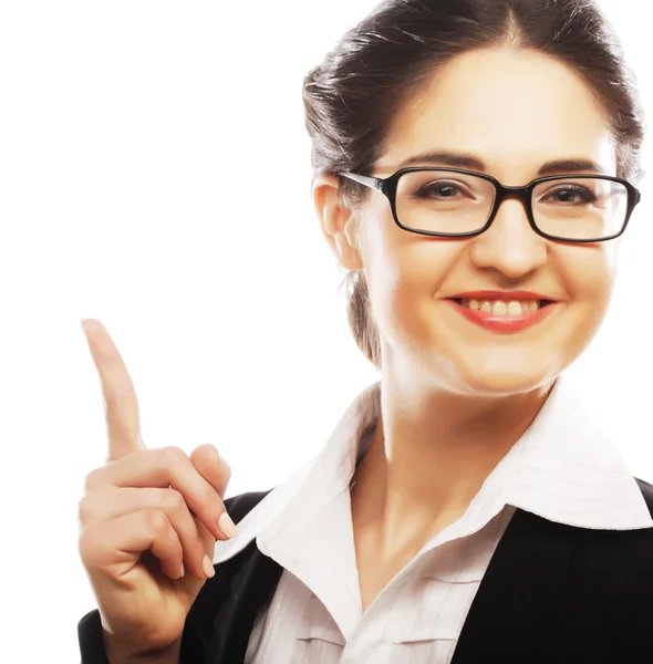 Woman wearing glasses pointing up — Stock Photo, Image