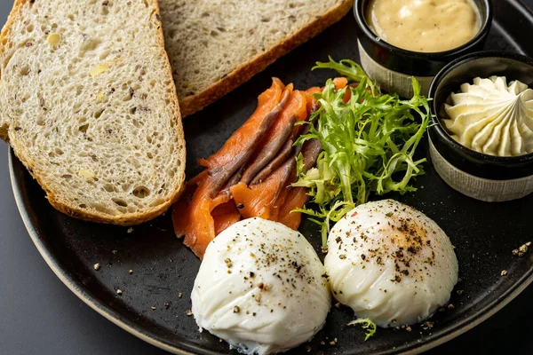 Healthy breakfast. Whole wheat toasted bread with avocado, poached egg, soft cheese and sprouts on white background. top view. Healthy diet food. High quality photo