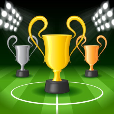parlak spot ışıkları ve üç ödül Kupası futbol arka plan