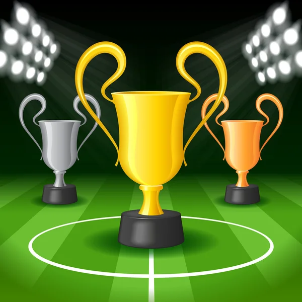 Soccer Background with Bright Spot Lights and Three Award Trophy — Stock Vector