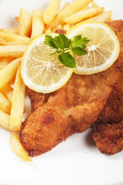 Viener schnitzel, breaded steak with french fries — Stock Photo, Image