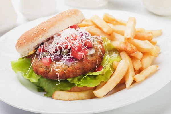 Hamburger with grated cheese — Stock Photo, Image