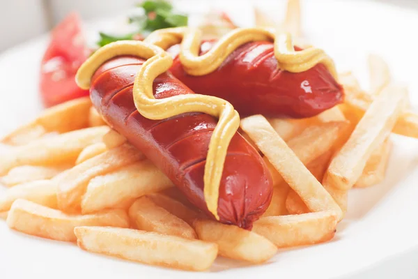 Fried sausage with french fries — Stock Photo, Image