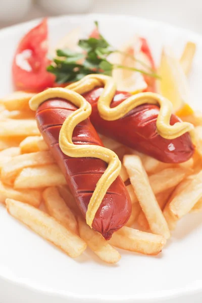 Fried sausage with french fries — Stock Photo, Image