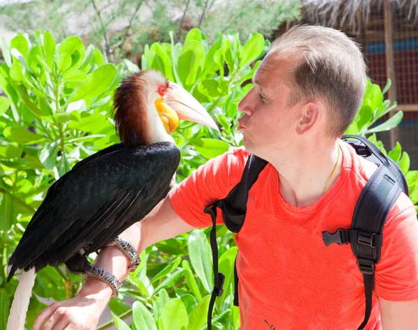 Portrait of the man with a toucan — Stock Photo, Image