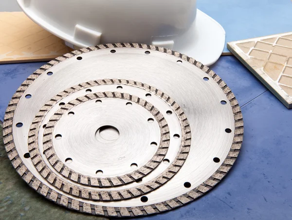 Diamond discs for cutting of tile and a helmet — Stock Photo, Image