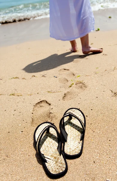 Beach slippers on sand — Stock Photo, Image