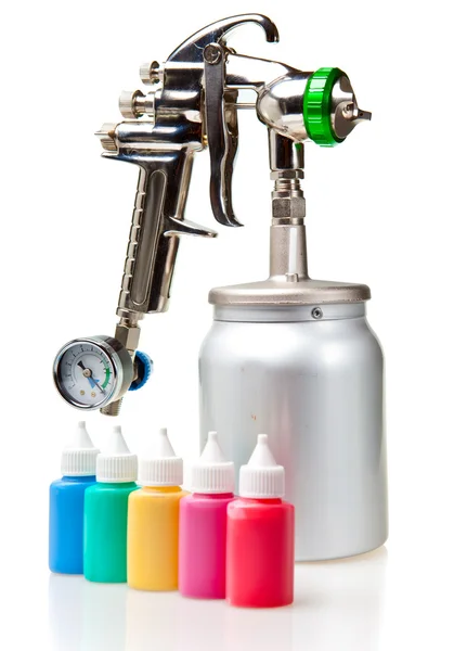 New metal brilliant Spray gun and small bottles with color — Stock Photo, Image