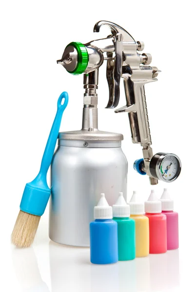 New metal brilliant Spray gun and small bottles with color — Stock Photo, Image