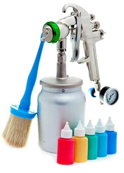 New metal brilliant Spray gun and small bottles with color — Stock Photo, Image