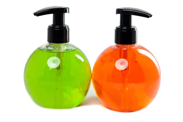 Botellas pequeñas cosméticas de color brillante con el dispensador —  Fotos de Stock