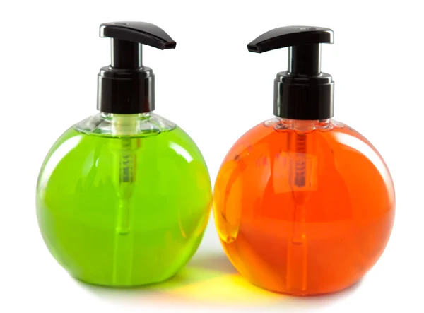 Botellas pequeñas cosméticas de color brillante con el dispensador —  Fotos de Stock