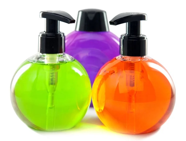 Garrafas pequenas cosméticas da cor brilhante com o distribuidor — Fotografia de Stock