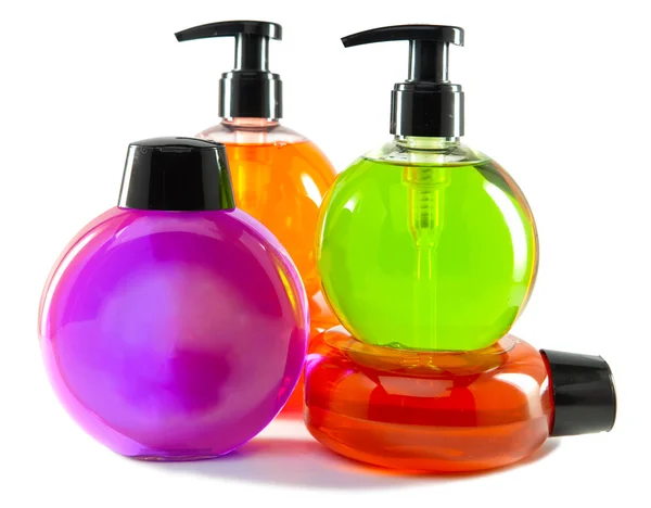 Piccole bottiglie cosmetiche a colori vivaci con il dispenser — Foto Stock