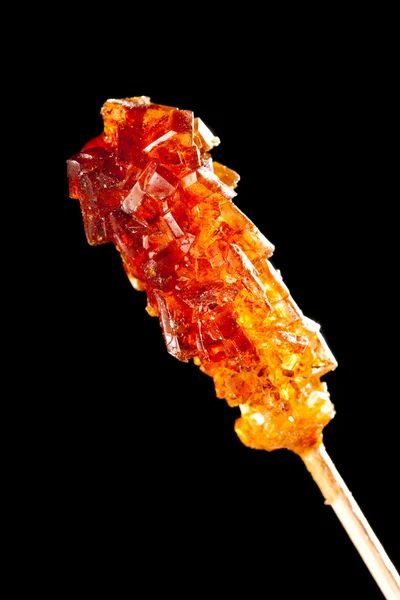 Candy brown sugar on a stick — Stock Photo, Image