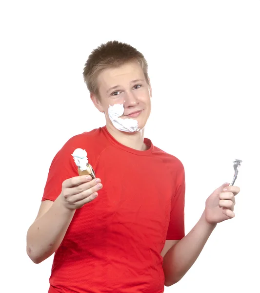 The boy, the teenager the first time tries to have a shave and is confused. — Stock Photo, Image