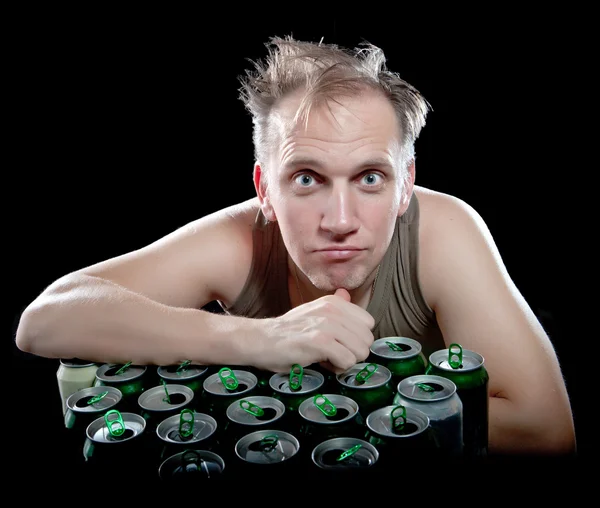 The drunk man and is a lot of empty beer can — Stock Photo, Image