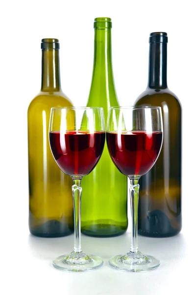 Bright colorful wine bottles and glass — Stock Photo, Image