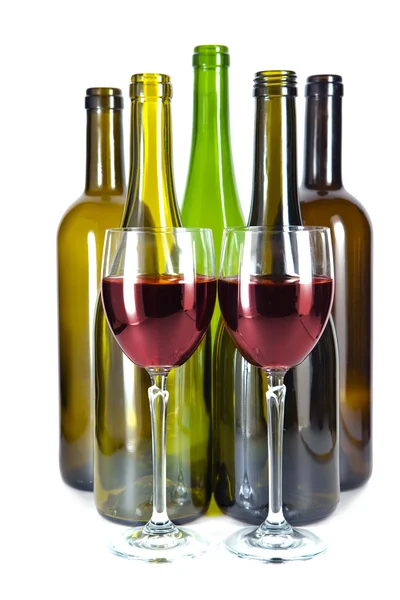 Bright colorful wine bottles and glass — Stock Photo, Image