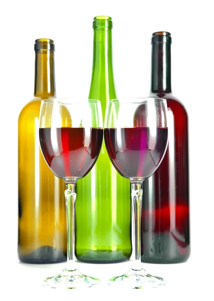 Bright colorful wine bottles and glass — Stock Photo, Image