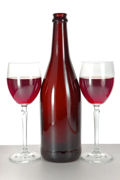 Bright colorful wine bottles and glass — Stock Photo, Image