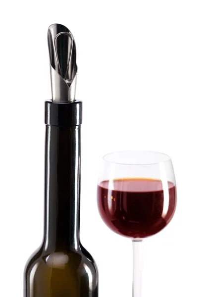 Bottle with a special nozzle for wine pouring and a wine glass — Stock Photo, Image