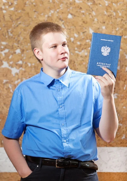 Schoolboy with the certificate about completion of education at school.. — Stock Photo, Image