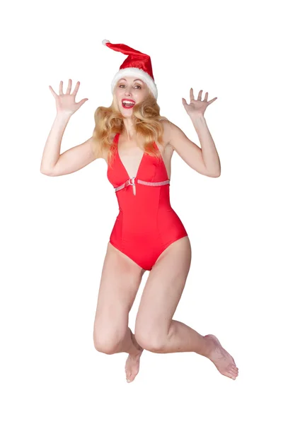 La bella donna in costume da bagno rosso e un berretto rosso di Babbo Natale — Foto Stock