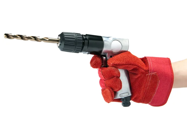 Hand in a working glove holds reversible air drill — Stock Photo, Image