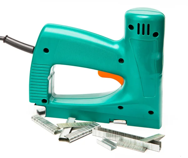 The tool - an electrical stapler for repair work in the house and on furniture, and brackets — Stock Photo, Image