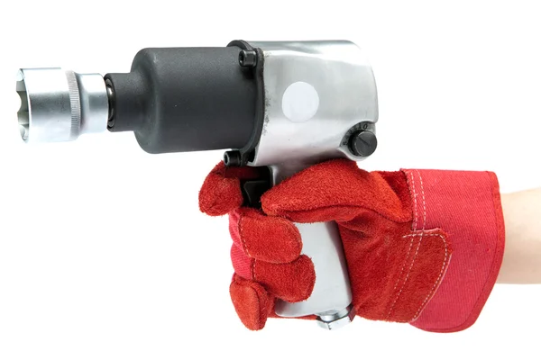 Mano en un guante de trabajo sostiene la llave de impacto de aire —  Fotos de Stock