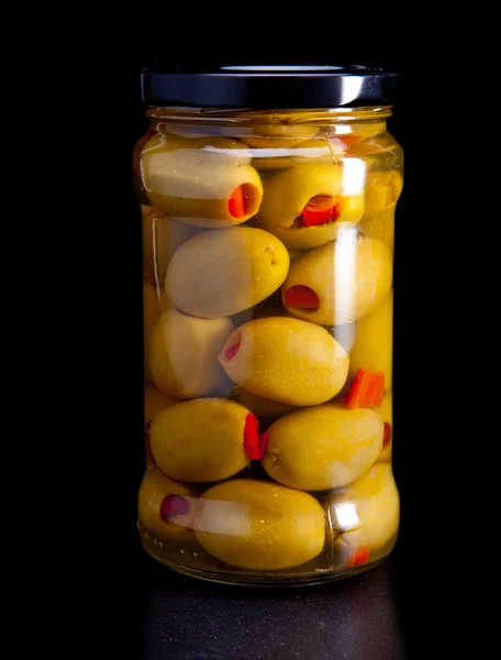 Glass jar with tinned olives — Stock Photo, Image