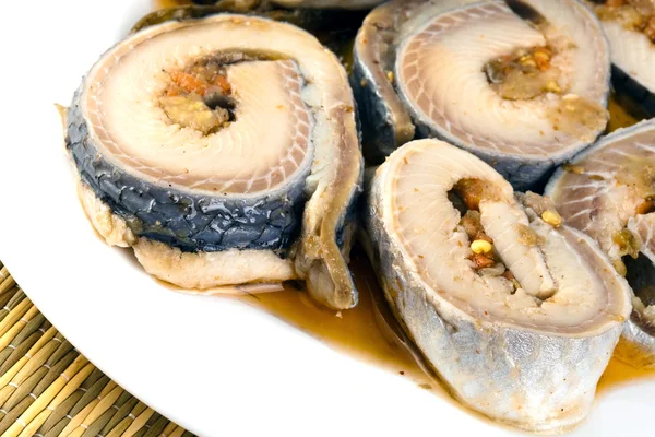 Rolls from a herring on a plate — Stock Photo, Image