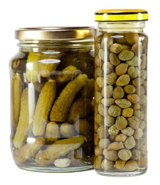 Glass jar with tinned capers and cucumber — Stock Photo, Image