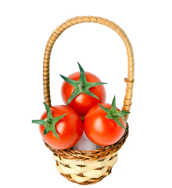 Cesta pequena e três tomates cerejas — Fotografia de Stock