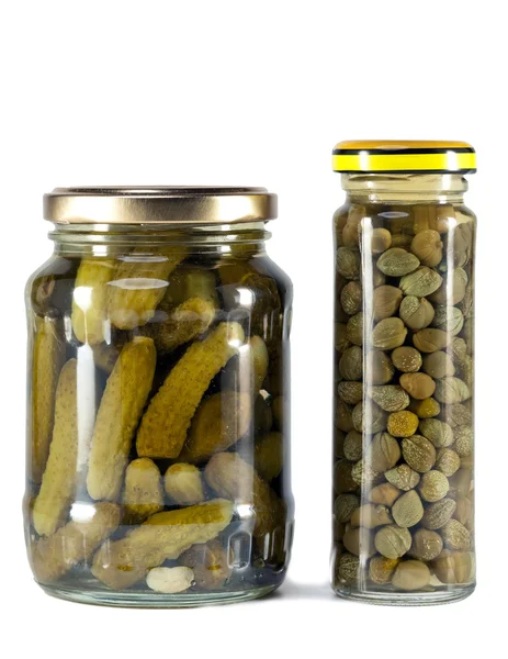 Glass jar with tinned capers and cucumber — Stock Photo, Image