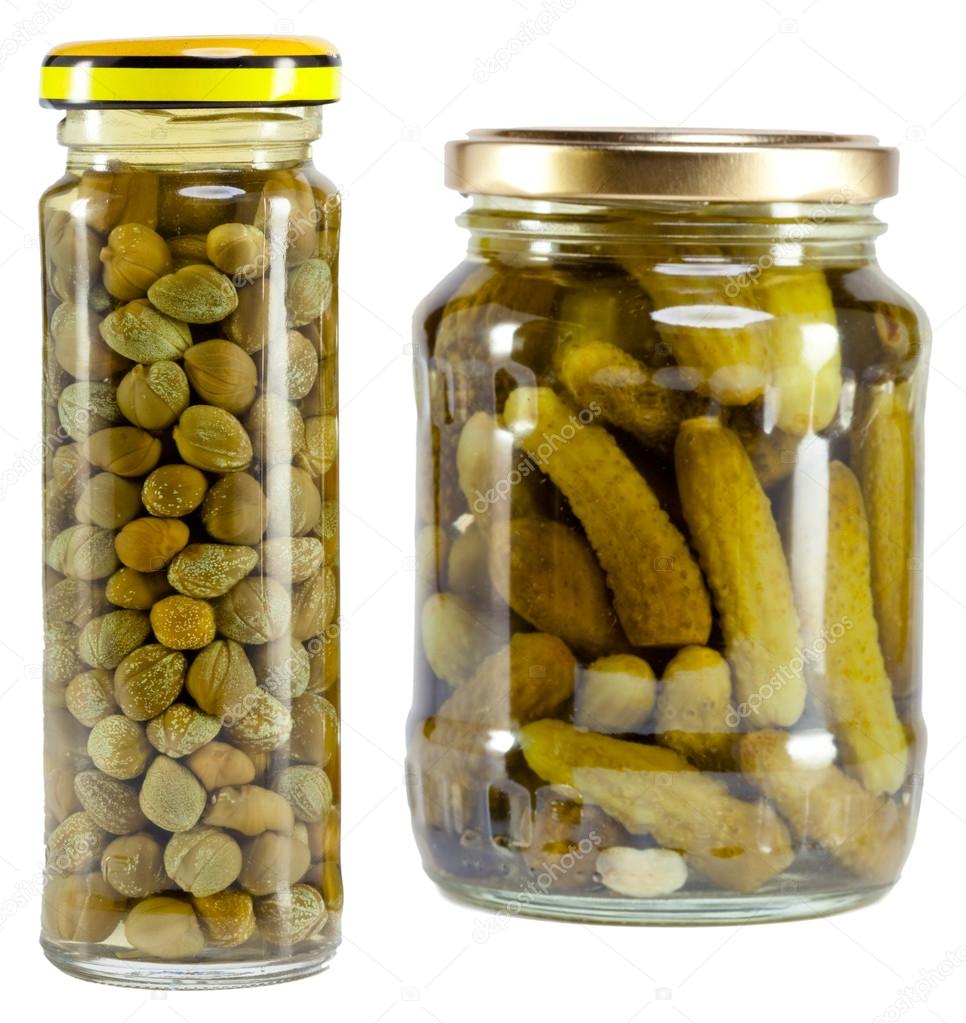 Glass jar with tinned capers and cucumber