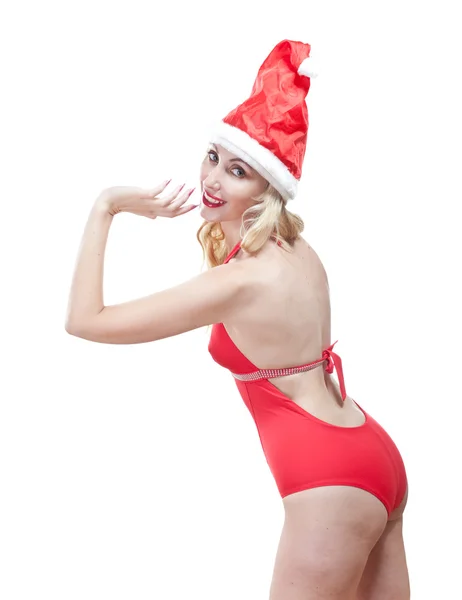 La hermosa mujer en un traje de baño rojo y una gorra roja de Santa Claus —  Fotos de Stock