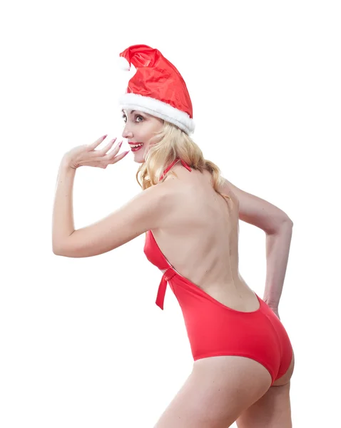 빨간 수영복과 산타 클로스의 빨간 모자에 아름 다운 여자 — 스톡 사진