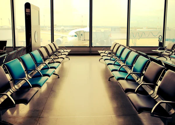 Empty armchairs in hall of airport ,with a retro effect — Stock Photo, Image