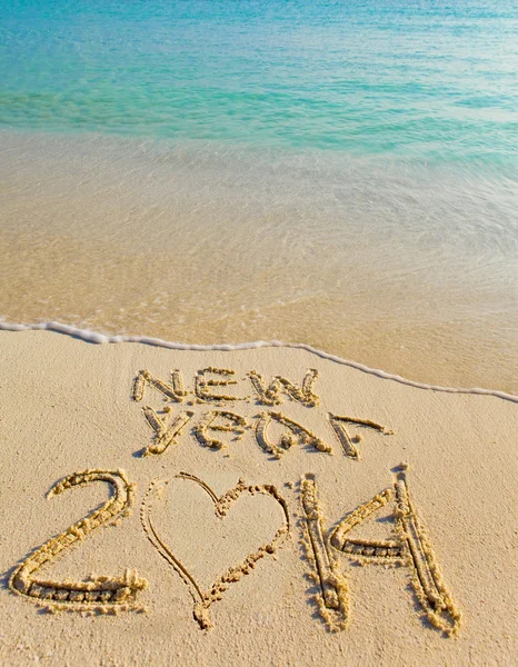 2014 inscription on the sand near the sea. — Stock Photo, Image