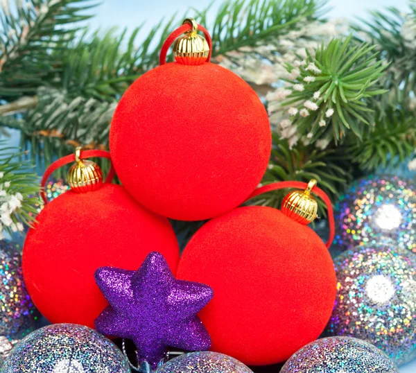 Red New Year's balls and branches with the snow — Stock Photo, Image