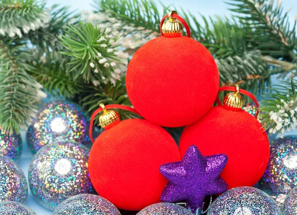 Red and silvery New Year's balls and branches with the snow — Stock Photo, Image