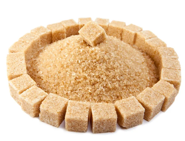 Sugar cube on a heap of granulated sugar — Stock Photo, Image