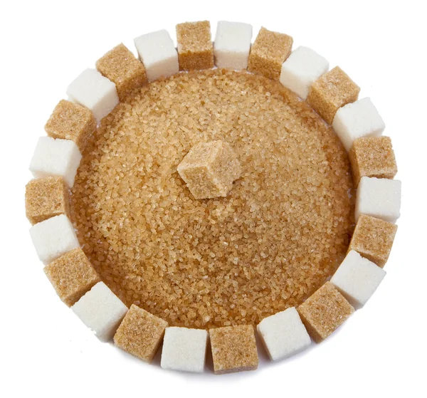 Sugar cube on a heap of granulated sugar — Stock Photo, Image