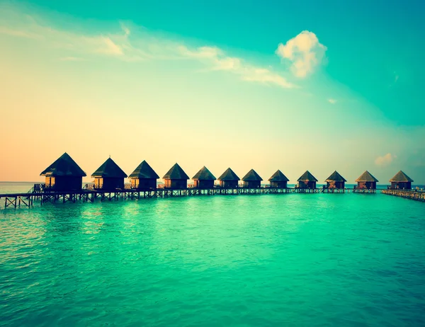 Houses over the transparent quiet sea water,with a retro effect — Stock Photo, Image